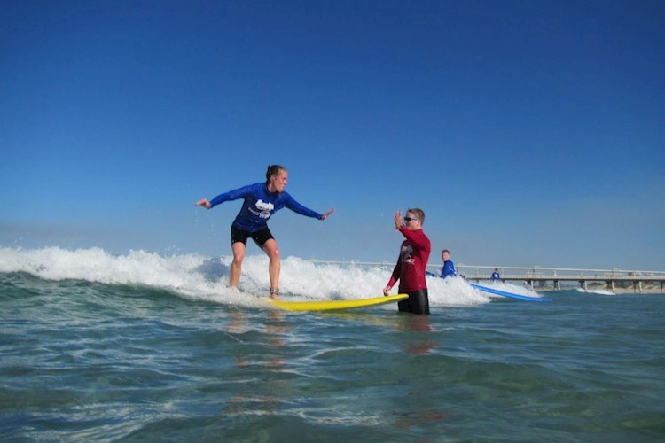 Learn to Surf in Surfers Paradise- Fun and supporting coaches.jpg